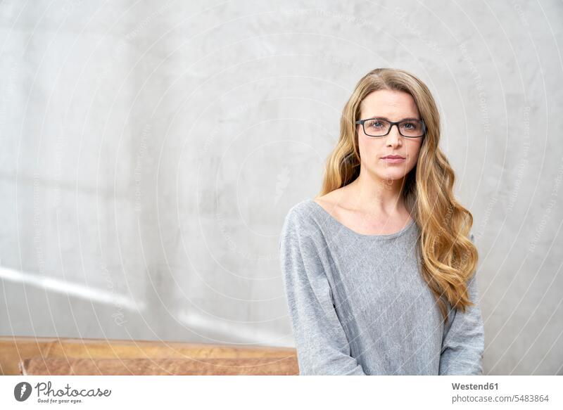 Portrait of serious blond woman wearing glases portrait portraits earnest Seriousness austere females women Adults grown-ups grownups adult people persons