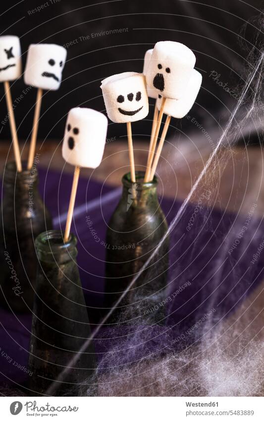 Halloween marshmallows with ghost faces on skewers studio shot studio shots studio photograph studio photographs copy space Ghost Ghosts Specters Spirits