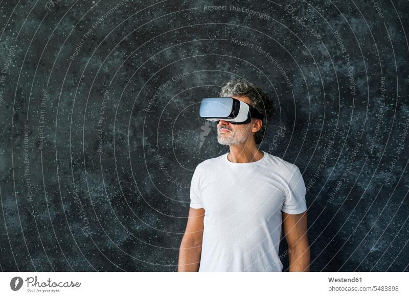 Mature man looking through VR glasses Looking Through Object Looking Through an Object Virtual Reality Glasses Virtual-Reality Glasses virtual reality headset
