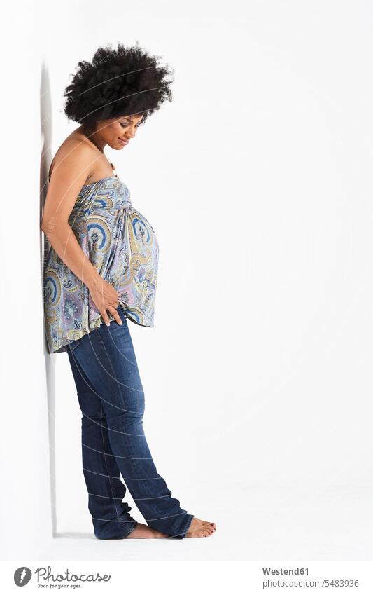 Pregnant woman leaning against wall pregnant Pregnant Woman females women Adults grown-ups grownups adult people persons human being humans human beings
