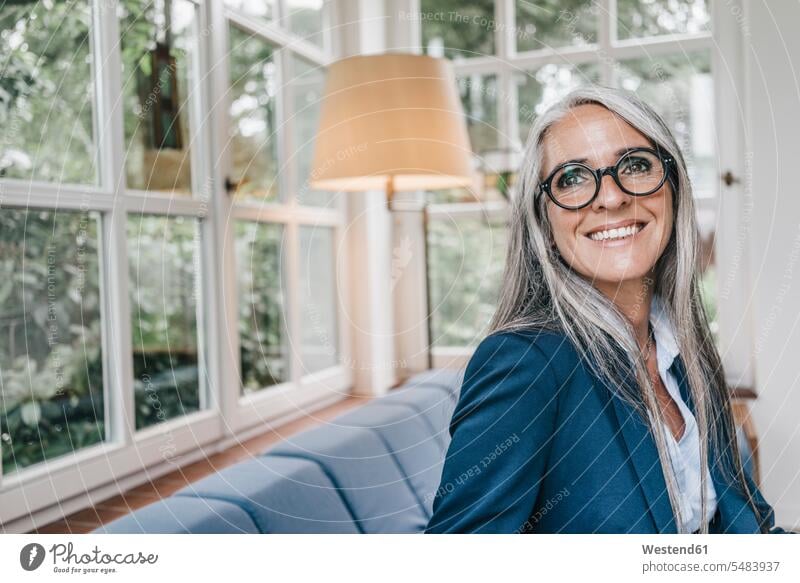Portrait of smiling woman with spectacles in winter garden smile portrait portraits females women Adults grown-ups grownups adult people persons human being