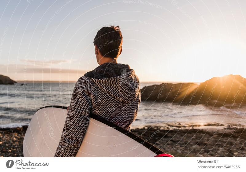 France, Bretagne, Crozon peninsula, woman on the beach at sunset with surfboard surfboards beaches sunsets sundown females women surfing surf ride surf riding