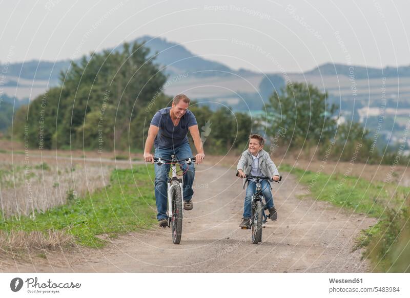 Germany, Rhineland-Palatinate, little boy on bicycle tour with his father caucasian caucasian ethnicity caucasian appearance european day daylight shot