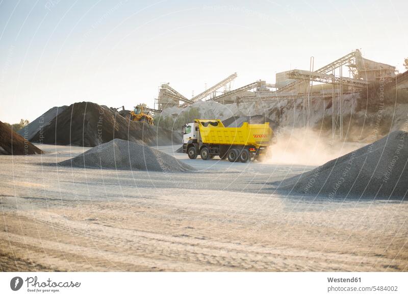 Dump truck at quarry working At Work driving drive mining dump truck gravel pit open-pit mining surface mine surface mining strip mining Open-Pit Mine