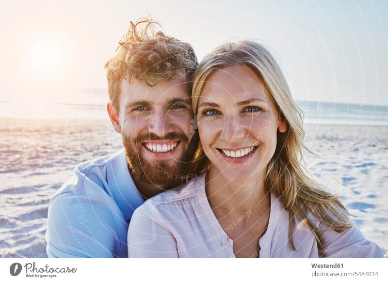 Portrait of happy couple on the beach beaches smiling smile twosomes partnership couples happiness people persons human being humans human beings vacation