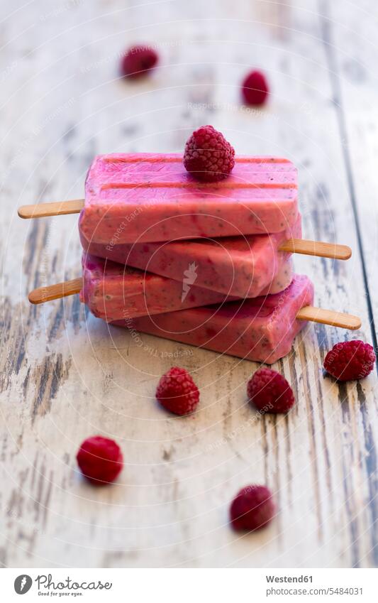 Stack of homemade raspberry ice lollies Salvia hispanica chia Ice Lolly Iced Lolly Ice Lollies Iced-Lolly chia seeds Chia Seed Refreshment refreshing wooden