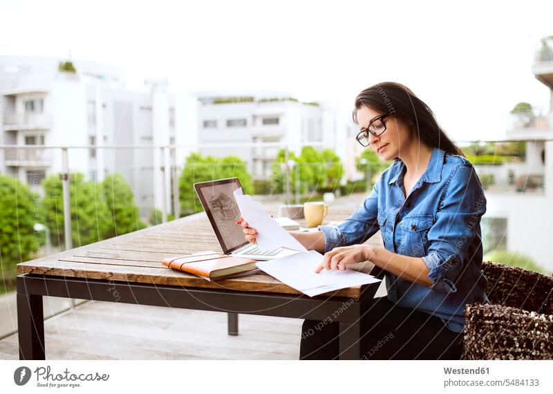 Woman working on balcony at home woman females women home office working from home home business Adults grown-ups grownups adult people persons human being