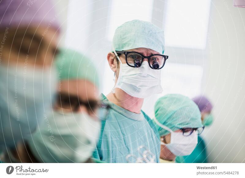 Surgeons in operating theatre doctor physicians doctors healthcare and medicine medical Healthcare And Medicines surgery Surgical operating room operating rooms
