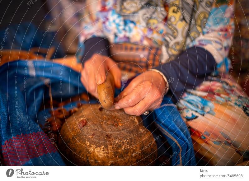 Argan oil manufactory Argan fruit kernels Morocco Handcrafts Oil Manufacture Kernels & Pits & Stones Colour photo Shatter hands stones crack break open"