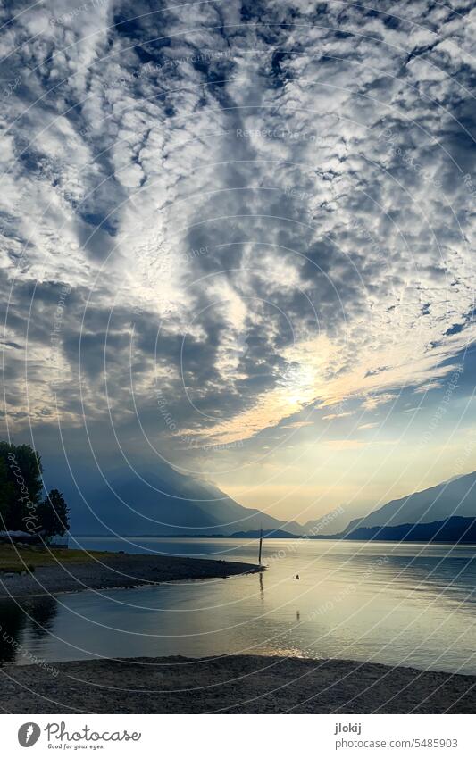 A morning on Lake Como vacation Relaxation Deserted Clouds Sunrise Light rays trees Beach Exterior shot Nature Sky Colour photo Calm tranquillity mountains Alps