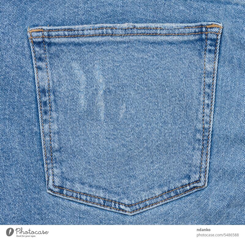 Back pocket of blue jeans - a Royalty Free Stock Photo from Photocase