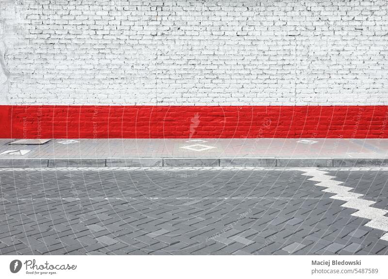 Street view of an old brick wall, urban background. street road city exterior pavement copy space no people outdoors red white empty Ecuador Riobamba