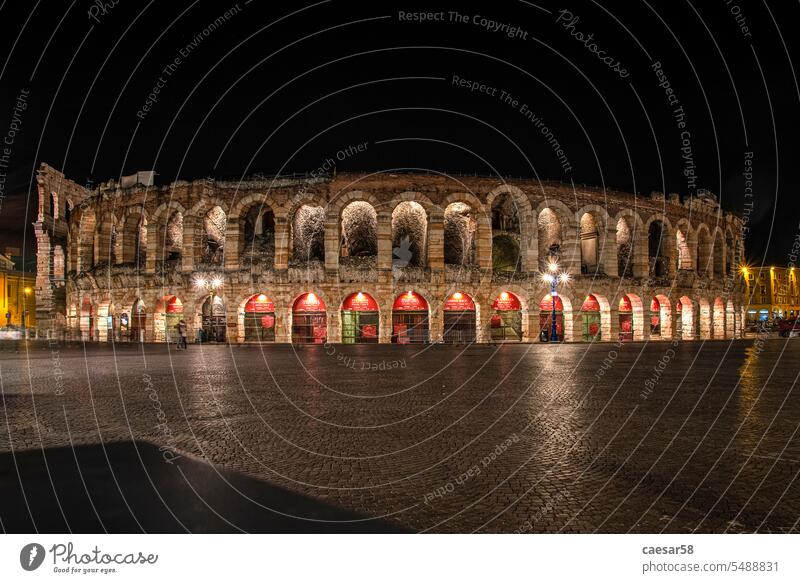 Beautifully illuminated Arena of Verona at Night arena landmark verona monument symbol ancient amphitheater night square abandoned old city colosseum dark italy