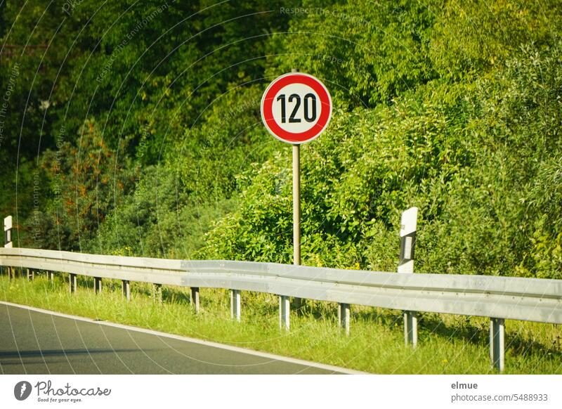 Traffic sign 120 km/h speed limit on the side of an expressway with crash barrier Road sign Speed limit tempolimit Speed limit on freeways Crash barrier Freeway