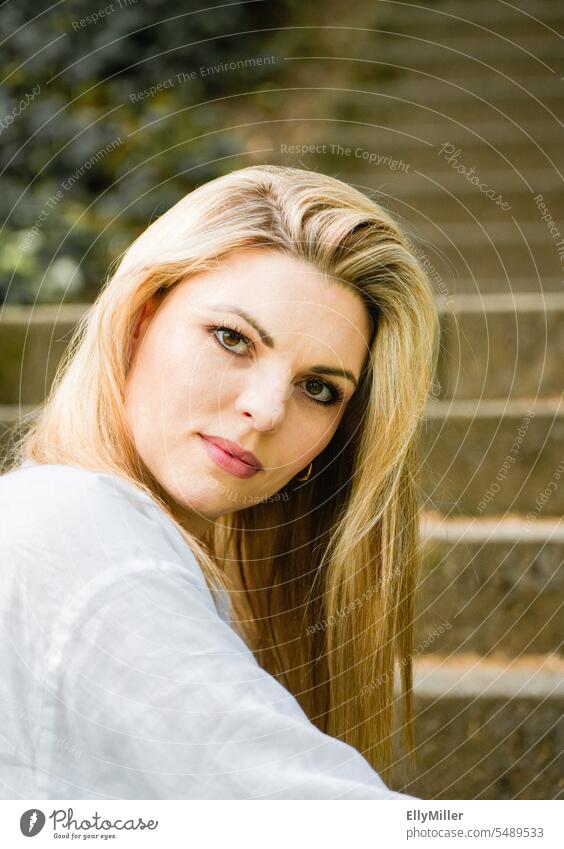 Portrait of a young blonde woman. Woman youthful portrait Long-haired Feminine feminine Face naturally long hairs Attractive Beauty & Beauty Young woman