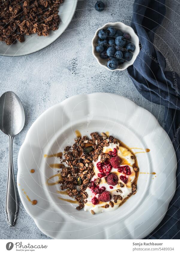 Granola, yogurt and fresh raspberries in a bowl. Top view, healthy breakfast. Cereal Yoghurt Raspberry Breakfast Healthy Eating Diet granola Bowl