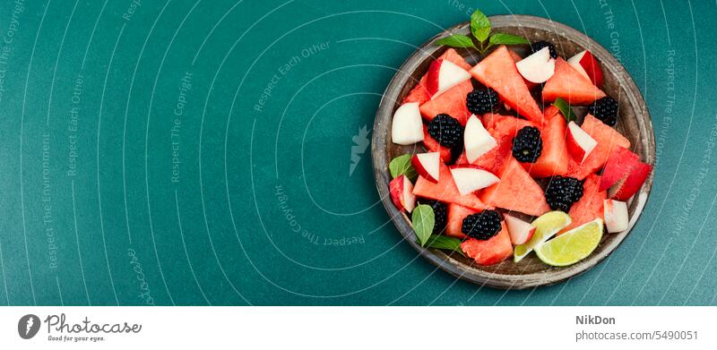 Fruity summer watermelon salad. fruit vegetarian vegan sweet food fresh diet appetizer red mint plate dish blackberry eating ripe raw juicy dessert colorful