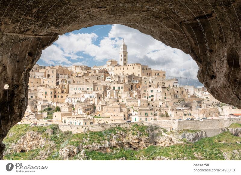 Scenic view of historic downtown with its cathedral, photo taken from a cave house, Southern Italy sassi di matera crude living simple scenic scenery primitive