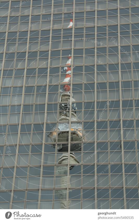 The Berlin television tower is reflected brokenly in a high-rise window facade. Window Television tower Berlin TV Tower Detuschland Capital city Federal capital