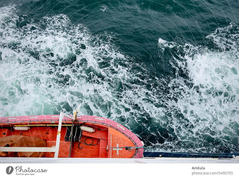View from a ferry down to the Baltic Sea with waves and an orange lifeboat Ferry Lifeboat Water Ocean Waves Navigation Watercraft Vacation & Travel Tourism