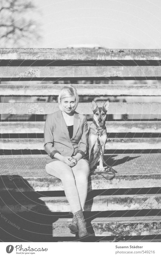 buddies Body 1 Human being Wall (barrier) Wall (building) Animal Dog Smiling Sit Friendship Love of animals Shepherd dog Blonde Young woman Black & white photo