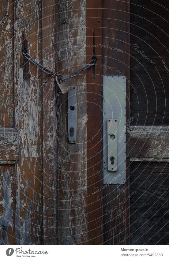 Door locked with chain door Chain Lock door handle Door handles Entrance Front door Safety Wooden door Closed Old Metal Goal Wooden gate Main gate Keyhole Rent