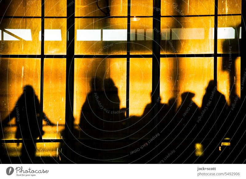 waiting in the station in the evening sun Glas facade Alexanderplatz Train station Silhouette Back-light evening light Warmth Shadow Sunlight Human being Hall