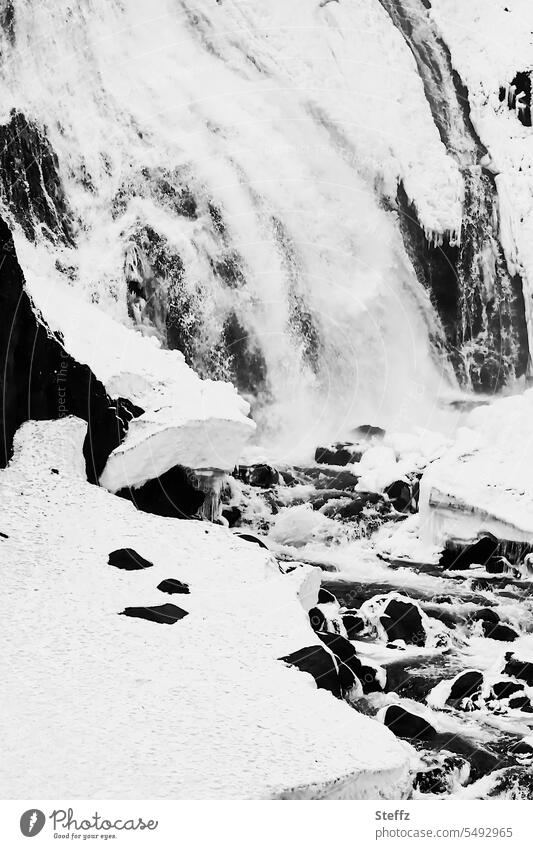 Waterfall neckline with snow, rocks and icy water on Iceland East Iceland icily Cold Water cascade Snow Snow layer snow-covered Frost chill primal power Force