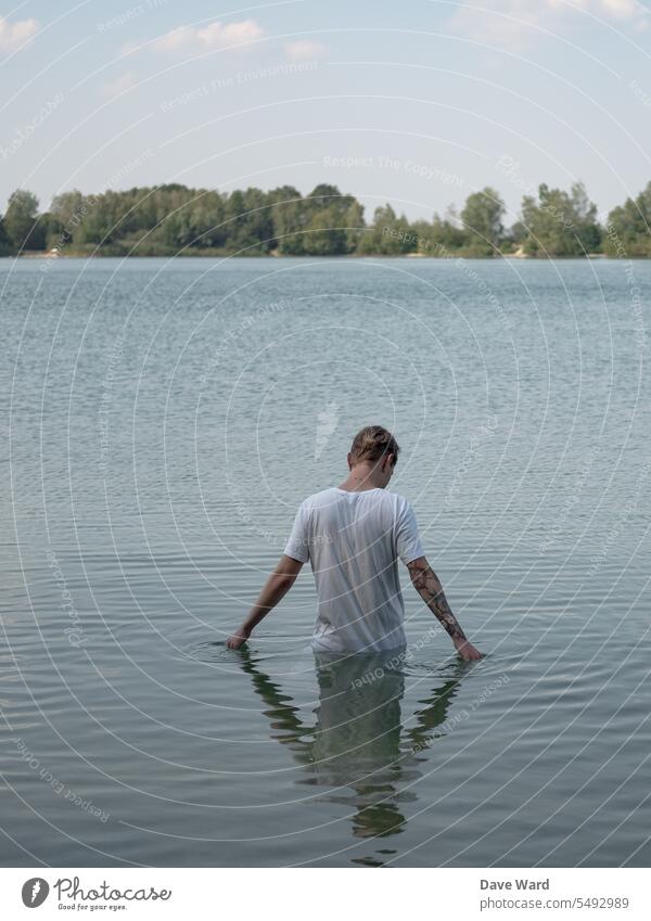 Man standing in water Lake Water Nature Exterior shot Reflection Deserted