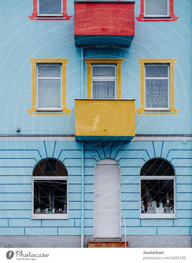 Blue house facade of the Wilhelminian period with colored balconies and window frames House (Residential Structure) Facade symmetric Yellow Red Balcony bullerbü