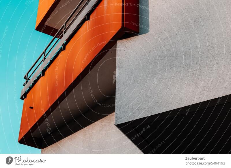 Balcony in orange, facade in gray, corners and edges on modern apartment building Orange Facade Gray Corners Edges Apartment Building Architecture Modern Shadow