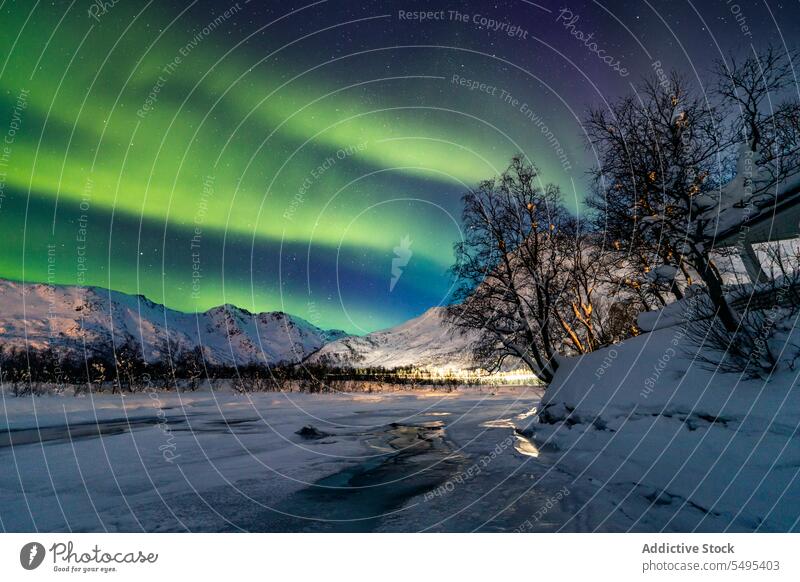Landscape illuminated with northern lights aurora borealis landscape breathtaking starry polar winter river mountain norway lapland lofoten island europe
