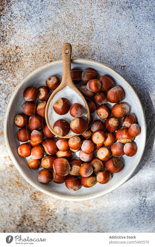 Bowl of natural chestnuts in shells bunch fresh bowl whole ingredient colorful bright organic product vegan vegetarian composition raw collection heap ceramic