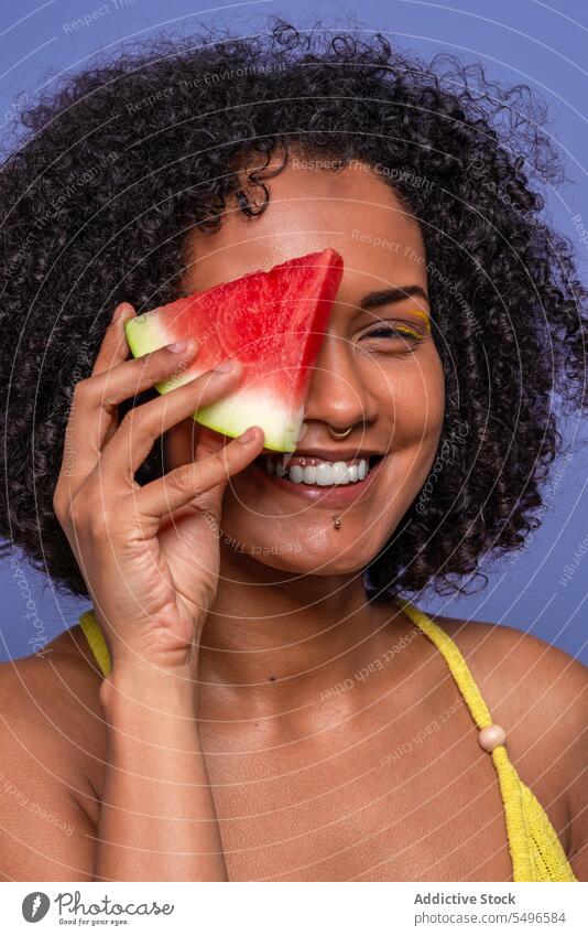 Positive black woman with yummy watermelon model sweet slice friendly hide charismatic portrait female african american juicy citrus fruit fresh dessert vitamin