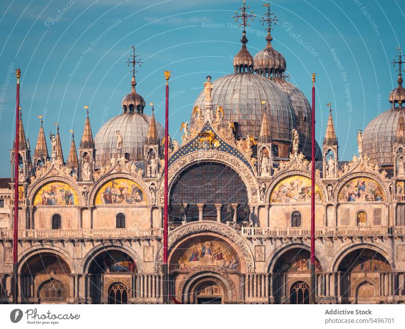 Arched facade of historic church under blue sky basilica architecture dome heritage sightseeing catholic landmark exterior religion ancient cathedral