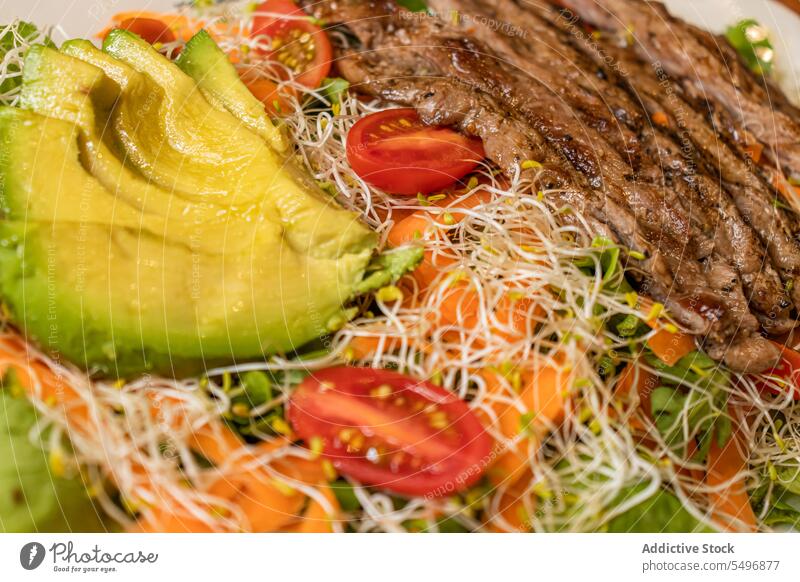 Delicious roasted meat with vegetables and sprouts in light beef avocado veggie grill food plate healthy food tomato delicious tasty serve carrot fresh