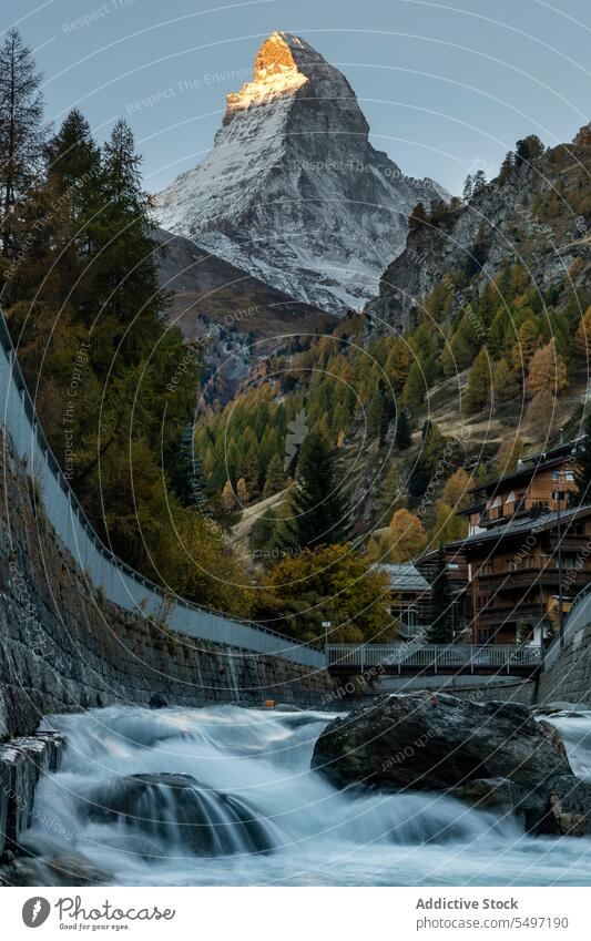 Picturesque river view near hills and mountains under the sky ridge highland nature picturesque breathtaking Matterhorn paradise harmony cloud blue sky idyllic