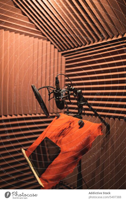 Recording studio with microphone equipment and tablet on desk in lights podcast record device gadget room professional modern design electronic creative