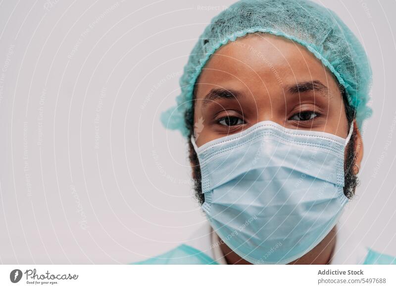 Ethnic male surgeon looking at camera in hospital man doctor professional specialist serious clinic medical portrait african american work young ethnic