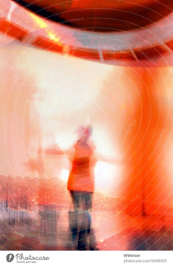 This may be a girl in a red jacket dancing with her arms outstretched shape Human being Figure Girl Woman Orange Red Rotate Dance Glimmer Abstract Dreamily