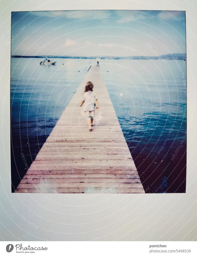 polaroid. a girl walks across a footbridge over lake garda wooden walkway Lake Garda Footbridge Water vacation Polaroid Summer travel Vacation & Travel