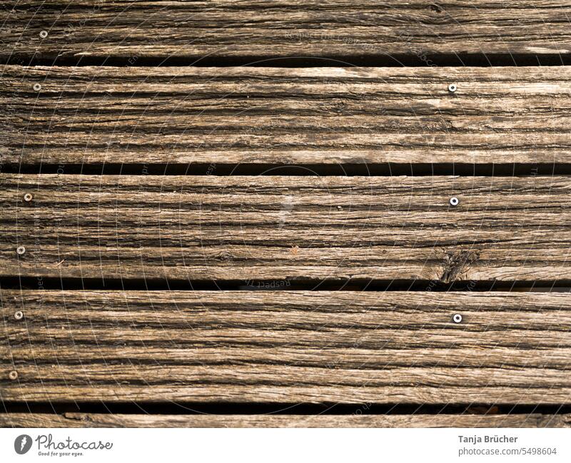 Fluted wooden planks of an old wooden bridge wooden floorboards Wood Wood planks Wooden boards Profile boards Wooden bridge With rivets Stud Screw