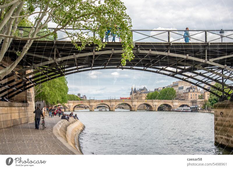Beneath the pcturesque Pont des Arts in Paris bridge river paris seine pont des arts french romance landmark alley beneath arch symbol construction iron