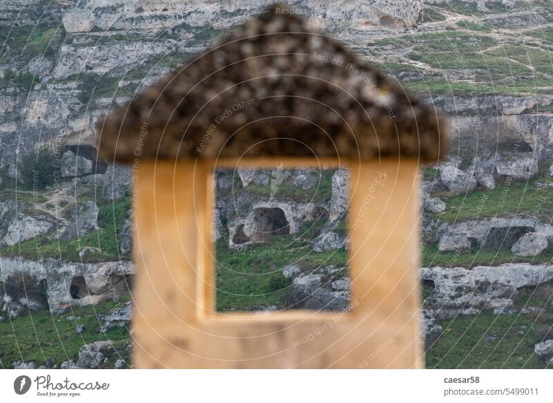 View on cave houses in Matera, seen through a chimney, Sassi di Matera in Southern Italy matera closeup view sassi cavern basilicata italy architecture building