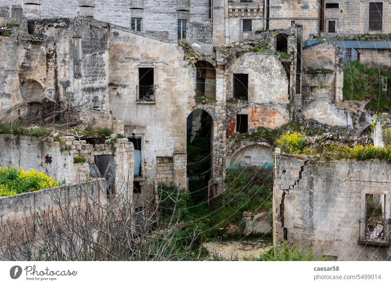 Cityscape of downtown Gravina in Italy italy abandoned house old architecture building empty cave windows no person ruin ruins ancient wall travel italian