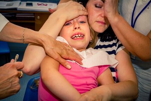 Frightened sweet little girl at dentist, dental care Care Caucasian Check Checkup Child Childhood Clinic Cry Dental Dentist Dentistry Doctor Examination