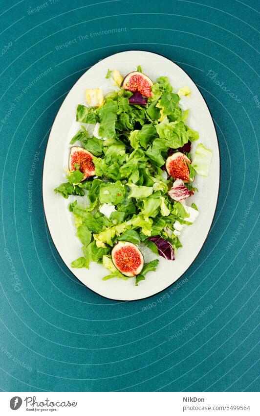 Salad with figs, herbs and cheese. salad fruit autumn useful vitamin salad ripe dietary plate lettuce flat lay top view green healthy fresh food healthy salad