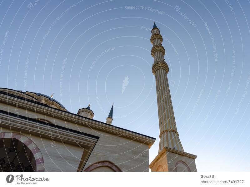 minaret of traditional Islamic mosque in Grozny Chechnya Russia ancient arab arabic architecture asia blue building chechnya city culture day famous fusion