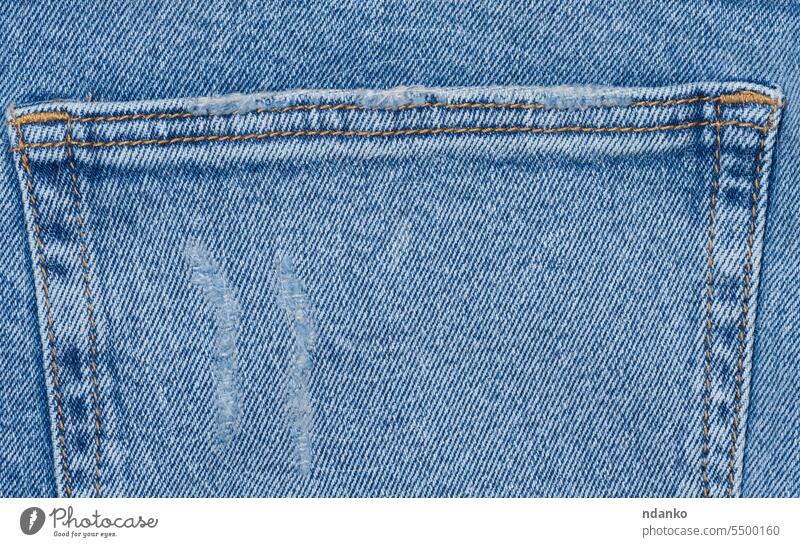 Fragment of the back pocket of blue jeans pants seam stitch textile texture trousers wear apparel canvas casual closeup clothing cotton denim design detail