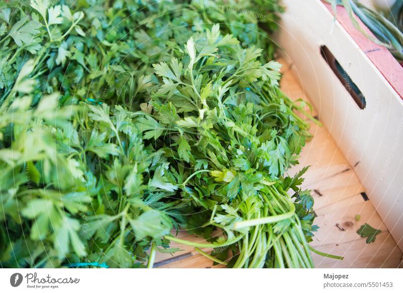 Bunches of parsley in wooden box. seasoning aromatic cooking herbal agriculture background beautiful bio bunch close up closeup color delicious ecology europe